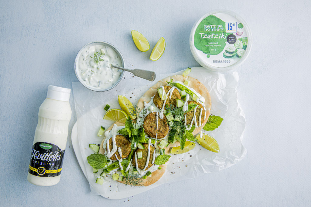 Garlic dressing and Tzatziki on falafel with mint and lime