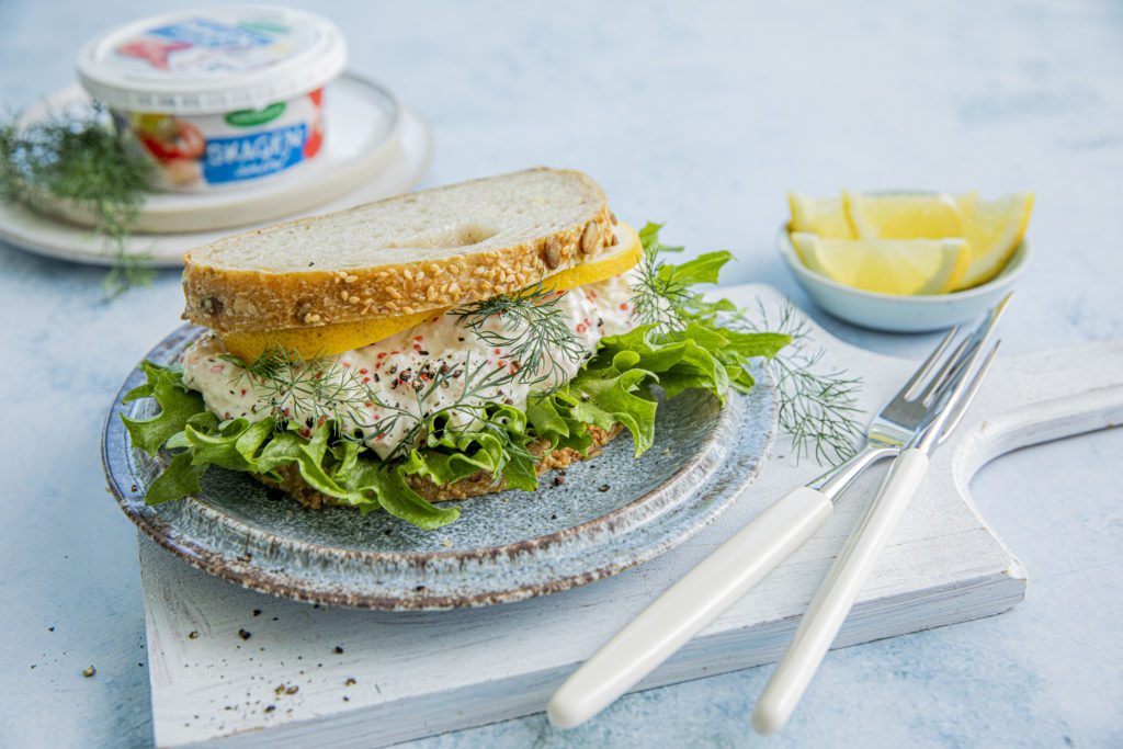 Skagen salad on sourdough bread with chrisi salad and lemon